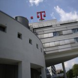 The logo of Deutsche Telekom AG is seen on top of the company's headquarter in Bonn May 24, 2012. REUTERS/Wolfgang Rattay The logo of Deutsche Telekom AG is seen on top of the company's headquarter in Bonn May 24, 2012. REUTERS/Wolfgang Rattay