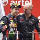 Red Bull Formula One driver Sebastian Vettel of Germany (L) celebrates on the podium with Red Bull technical chief Adrian Newey after winnin Red Bull Formula One driver Sebastian Vettel of Germany (L) celebrates on the podium with Red Bull technical chief Adrian Newey after winnin