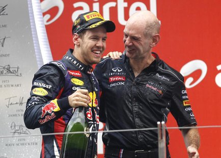 Red Bull Formula One driver Sebastian Vettel of Germany (L) celebrates on the podium with Red Bull technical chief Adrian Newey after winnin Red Bull Formula One driver Sebastian Vettel of Germany (L) celebrates on the podium with Red Bull technical chief Adrian Newey after winnin