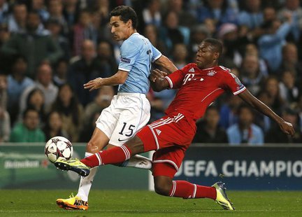 Manchester City's Jesus Navas (L) challenged by Bayern Munich's David Alaba during their Champions League soccer match at the Etihad Stadium Manchester City's Jesus Navas (L) challenged by Bayern Munich's David Alaba during their Champions League soccer match at the Etihad Stadium