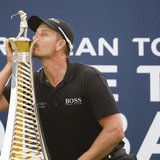 Henrik Stenson of Sweden kisses his 2013 Race to Dubai trophy after winning the DP World Tour Championship in Dubai November 17, 2013. REUTE Henrik Stenson of Sweden kisses his 2013 Race to Dubai trophy after winning the DP World Tour Championship in Dubai November 17, 2013. REUTE