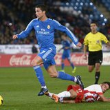 Real Madrid's Cristiano Ronaldo (top) is challenged by Almeria's Jesus Joaquin Fernandez "Suso" during their Spanish First Division soccer m Real Madrid's Cristiano Ronaldo (top) is challenged by Almeria's Jesus Joaquin Fernandez "Suso" during their Spanish First Division soccer m