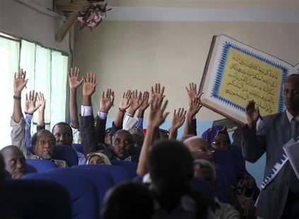 Members of the Somali parliament vote by a show of hands in Mogadishu December 2, 2013. REUTERS/Ismail Taxta Members of the Somali parliament vote by a show of hands in Mogadishu December 2, 2013. REUTERS/Ismail Taxta