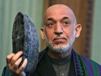 Afghanistan's President Hamid Karzai speaks during a joint news conference with Pakistan's Prime Minister Nawaz Sharif (not pictured) in Kab Afghanistan's President Hamid Karzai speaks during a joint news conference with Pakistan's Prime Minister Nawaz Sharif (not pictured) in Kab