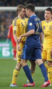 France's Laurent Koscielny (R) argues with Ukraine's Olexandr Kucher during their 2014 World Cup qualifying first leg playoff soccer match a France's Laurent Koscielny (R) argues with Ukraine's Olexandr Kucher during their 2014 World Cup qualifying first leg playoff soccer match a