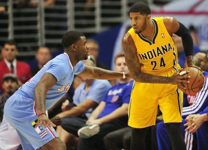 December 1, 2013; Los Angeles, CA, USA; Indiana Pacers small forward Paul George (24) controls the ball against the defense of Los Angeles C December 1, 2013; Los Angeles, CA, USA; Indiana Pacers small forward Paul George (24) controls the ball against the defense of Los Angeles C
