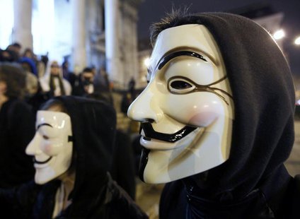 A protester wearing a Guy Fawkes mask, symbolic of the hacktivist group "Anonymous", takes part in a protest in central Brussels January 28, A protester wearing a Guy Fawkes mask, symbolic of the hacktivist group "Anonymous", takes part in a protest in central Brussels January 28,