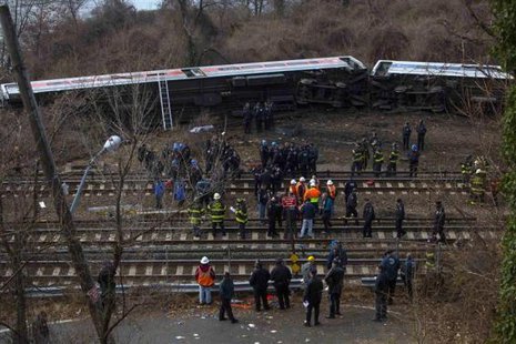Emergency workers stand at the site of a Metro-North train derailment in the Bronx borough of New York December 1, 2013.
CREDIT: REUTERS/ERIC THAYER Emergency workers stand at the site of a Metro-North train derailment in the Bronx borough of New York December 1, 2013.
CREDIT: REUTERS/ERIC THAYER