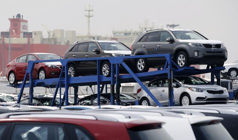 A truck transports cars made by South Korea's Hyundai Motor Group at the company's shipping yard at a port in Pyeongtaek, about 70 km (43 mi A truck transports cars made by South Korea's Hyundai Motor Group at the company's shipping yard at a port in Pyeongtaek, about 70 km (43 mi