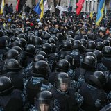 Police stand guard in front of protesters during a demonstration in support of EU integration in front of the Parliament building in Kiev De Police stand guard in front of protesters during a demonstration in support of EU integration in front of the Parliament building in Kiev De