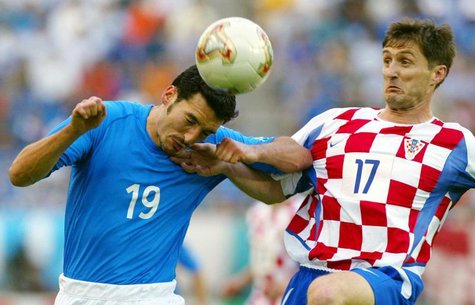 Italy's Gianluca Zambrotta (L) is challenged by Croatia's Robert Jarni (R) during their group G World Cup Finals soccer match in Ibaraki Sta Italy's Gianluca Zambrotta (L) is challenged by Croatia's Robert Jarni (R) during their group G World Cup Finals soccer match in Ibaraki Sta