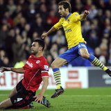Arsenal's Mathieu Flamini (R) scores a goal against Cardiff City during their English Premier League soccer match at Cardiff City Stadium in Arsenal's Mathieu Flamini (R) scores a goal against Cardiff City during their English Premier League soccer match at Cardiff City Stadium in