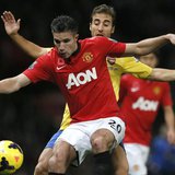 Arsenal's Mathieu Flamini challenges Manchester United's Robin van Persie (L) during their English Premier League soccer match at Old Traffo Arsenal's Mathieu Flamini challenges Manchester United's Robin van Persie (L) during their English Premier League soccer match at Old Traffo