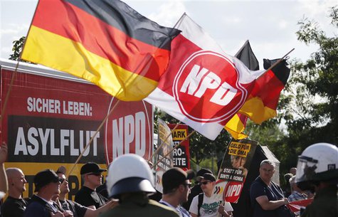Far-right National Democratic Party (NPD) supporters protest against a refugee asylum in the Hellersdorf district of Berlin, in this August Far-right National Democratic Party (NPD) supporters protest against a refugee asylum in the Hellersdorf district of Berlin, in this August