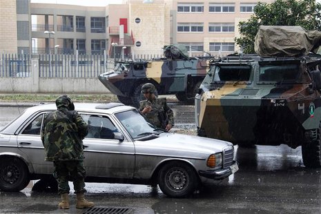 Lebanese army soldiers man a checkpoint during a patrol, following the government's decision to place the northern city under the supervisio Lebanese army soldiers man a checkpoint during a patrol, following the government's decision to place the northern city under the supervisio