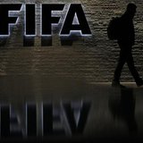 A man is silhouetted as he makes his way past the main entrance of FIFA headquarters, the Home of FIFA, in Zurich October 20, 2010. REUTERS/ A man is silhouetted as he makes his way past the main entrance of FIFA headquarters, the Home of FIFA, in Zurich October 20, 2010. REUTERS/