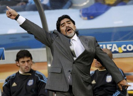 Argentina's coach Diego Maradona gestures during their 2010 World Cup quarter-final soccer match against Germany at Green Point stadium in C Argentina's coach Diego Maradona gestures during their 2010 World Cup quarter-final soccer match against Germany at Green Point stadium in C