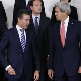 NATO Secretary General Anders Fogh Rasmussen and U.S. Secretary of State John Kerry (R) pose for a family photo during a NATO foreign minist NATO Secretary General Anders Fogh Rasmussen and U.S. Secretary of State John Kerry (R) pose for a family photo during a NATO foreign minist