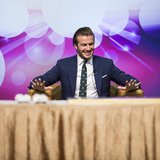 Former England soccer team captain David Beckham reacts during a promotional event at the Venetian Macao hotel in Macau November 22, 2013. R Former England soccer team captain David Beckham reacts during a promotional event at the Venetian Macao hotel in Macau November 22, 2013. R
