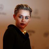 U.S. singer singer Miley Cyrus arrives on the red carpet for the Bambi 2013 media awards ceremony in Berlin November 14, 2013. REUTERS/Tobia U.S. singer singer Miley Cyrus arrives on the red carpet for the Bambi 2013 media awards ceremony in Berlin November 14, 2013. REUTERS/Tobia