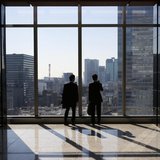 Businessmen are seen inside a high-rise office building in Tokyo November 21, 2013. REUTERS/Issei Kato Businessmen are seen inside a high-rise office building in Tokyo November 21, 2013. REUTERS/Issei Kato