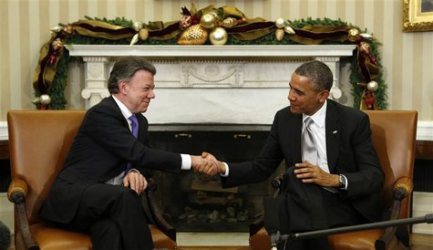 U.S. President Barack Obama shakes hands with Colombian President Juan Manuel Santos during their meeting in the Oval Office of the White Ho U.S. President Barack Obama shakes hands with Colombian President Juan Manuel Santos during their meeting in the Oval Office of the White Ho