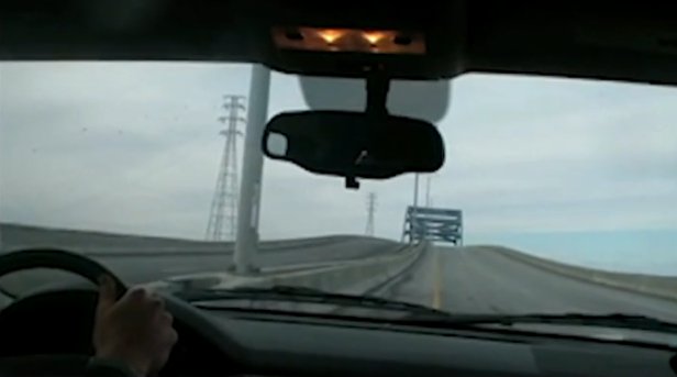 The first vehicle allowed across the bridge after stabilization was equipped with a "Snooper" to examine the bridge deck in early December. The asphalt was said to be in good shape. Courtesy of WisDOT.