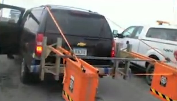The first vehicle allowed across the bridge after stabilization was equipped with a "Snooper" to examine the bridge deck in early December. The asphalt was said to be in good shape. Courtesy of WisDOT.