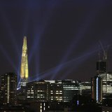 A laser beam touches the Gherkin from the Shard during the laser and searchlight show which marks the completion of the exterior of the Shar A laser beam touches the Gherkin from the Shard during the laser and searchlight show which marks the completion of the exterior of the Shar