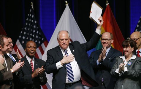 Illinois Governor Pat Quinn holds up the Religious Freedom and Marriage Fairness Act after signing it into law at a ceremony in Chicago, Ill Illinois Governor Pat Quinn holds up the Religious Freedom and Marriage Fairness Act after signing it into law at a ceremony in Chicago, Ill