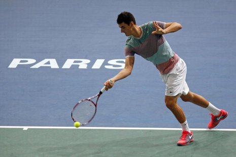 Australia's Bernard Tomic hits a return to Feliciano Lopez of Spain during the opening round match of the Paris Masters men's singles tennis Australia's Bernard Tomic hits a return to Feliciano Lopez of Spain during the opening round match of the Paris Masters men's singles tennis