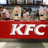 KFC's staff wait for customers at its restaurant in Beijing October 9, 2013. REUTERS/Kim Kyung-Hoon KFC's staff wait for customers at its restaurant in Beijing October 9, 2013. REUTERS/Kim Kyung-Hoon