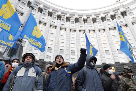 People gather in front of the Ukrainian cabinet of ministers building during a rally to support EU integration in Kiev December 4, 2013. REU People gather in front of the Ukrainian cabinet of ministers building during a rally to support EU integration in Kiev December 4, 2013. REU