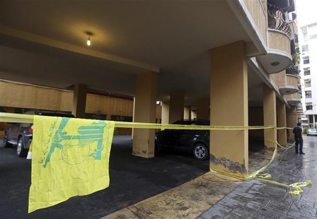 A Hezbollah flag is seen near the crime scene where commander Hasan al-Laqqis was killed in the southern Hadath district in Beirut December A Hezbollah flag is seen near the crime scene where commander Hasan al-Laqqis was killed in the southern Hadath district in Beirut December