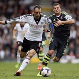 Fulham's Dimitar Berbatov (L) challenges Stoke City's Erik Pieters during their English Premier League soccer match at Craven Cottage in Lon Fulham's Dimitar Berbatov (L) challenges Stoke City's Erik Pieters during their English Premier League soccer match at Craven Cottage in Lon