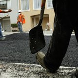 Workers spread asphalt on a street in the Cow Hollow neighborhood in San Francisco, California June 2, 2010. REUTERS/Robert Galbraith Workers spread asphalt on a street in the Cow Hollow neighborhood in San Francisco, California June 2, 2010. REUTERS/Robert Galbraith