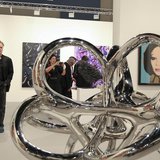 Art patrons are framed by World As Flow by Saint Clair Cemin at Art Basel in Miami Beach, Florida December 5, 2012. REUTERS/Robert Sullivan Art patrons are framed by World As Flow by Saint Clair Cemin at Art Basel in Miami Beach, Florida December 5, 2012. REUTERS/Robert Sullivan