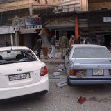 Damaged cars with shattered screens are seen at a site hit by a rocket at al Furqan neighbourhood in western Aleppo December 4, 2013. REUTER Damaged cars with shattered screens are seen at a site hit by a rocket at al Furqan neighbourhood in western Aleppo December 4, 2013. REUTER