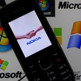 A Nokia mobile phone lies on a tablet computer showing logos of Microsoft, in this illustration picture taken in Frankfurt, November 18, 201 A Nokia mobile phone lies on a tablet computer showing logos of Microsoft, in this illustration picture taken in Frankfurt, November 18, 201