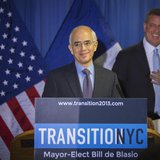 Anthony Shorris reacts after being teased about his height during the announcement by New York Mayor elect Bill de Blasio (R) that Shorris w Anthony Shorris reacts after being teased about his height during the announcement by New York Mayor elect Bill de Blasio (R) that Shorris w