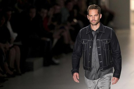 U.S. actor Paul Walker presents a creation from Colcci's 2013/2014 summer collection during Sao Paulo Fashion Week March 21, 2013. REUTERS/F U.S. actor Paul Walker presents a creation from Colcci's 2013/2014 summer collection during Sao Paulo Fashion Week March 21, 2013. REUTERS/F