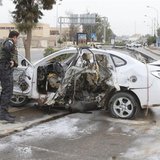 An Iraqi security forces personnel inspects a car after a bomb in Kirkuk, 250 km (155 miles) north of Baghdad, December 4, 2013. REUTERS/Ako An Iraqi security forces personnel inspects a car after a bomb in Kirkuk, 250 km (155 miles) north of Baghdad, December 4, 2013. REUTERS/Ako