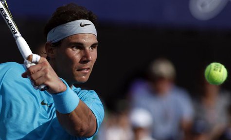 Rafael Nadal of Spain plays a shot during his exhibition tennis match against Novak Djokovic of Serbia in Buenos Aires November 24, 2013. RE Rafael Nadal of Spain plays a shot during his exhibition tennis match against Novak Djokovic of Serbia in Buenos Aires November 24, 2013. RE
