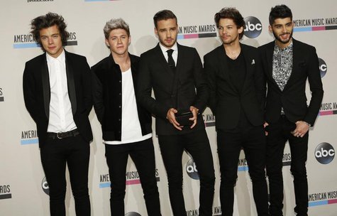 One Direction poses backstage with one of the two awards they won at the 41st American Music Awards in Los Angeles, California November 24, One Direction poses backstage with one of the two awards they won at the 41st American Music Awards in Los Angeles, California November 24,