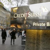 The logo of Swiss bank Credit Suisse is seen in front of a branch office in Zurich November 21, 2013. REUTERS/Arnd Wiegmann The logo of Swiss bank Credit Suisse is seen in front of a branch office in Zurich November 21, 2013. REUTERS/Arnd Wiegmann