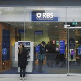A woman stands in front of a Royal Bank of Scotland (RBS) cash machine, in central London December 3, 2013. REUTERS/Luke MacGregor A woman stands in front of a Royal Bank of Scotland (RBS) cash machine, in central London December 3, 2013. REUTERS/Luke MacGregor