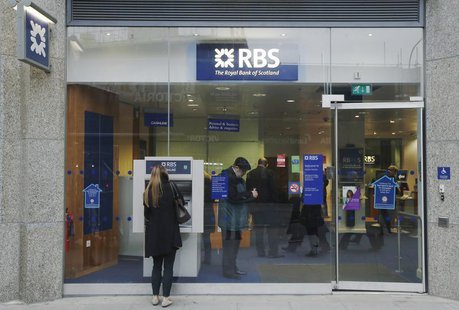 A woman stands in front of a Royal Bank of Scotland (RBS) cash machine, in central London December 3, 2013. REUTERS/Luke MacGregor A woman stands in front of a Royal Bank of Scotland (RBS) cash machine, in central London December 3, 2013. REUTERS/Luke MacGregor