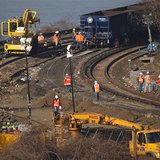 Workers are seen on the tracks of the Metro-North train derailment in the Bronx borough of New York December 3, 2013. REUTERS/Shannon Staple Workers are seen on the tracks of the Metro-North train derailment in the Bronx borough of New York December 3, 2013. REUTERS/Shannon Staple