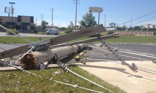 A downed power pole from along Richmond St. in Appleton, near Ridgeview Dr., is seen in the parking lot of KimCentral Credit Union, Aug. 8, 2013. (Photo from: FOX 11). A downed power pole from along Richmond St. in Appleton, near Ridgeview Dr., is seen in the parking lot of KimCentral Credit Union, Aug. 8, 2013. (Photo from: FOX 11).