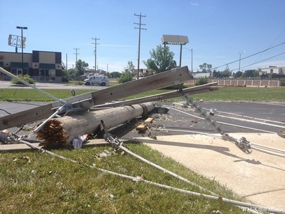 A downed power pole from along Richmond St. in Appleton, near Ridgeview Dr., is seen in the parking lot of KimCentral Credit Union, Aug. 8, 2013. (Photo from: FOX 11). A downed power pole from along Richmond St. in Appleton, near Ridgeview Dr., is seen in the parking lot of KimCentral Credit Union, Aug. 8, 2013. (Photo from: FOX 11).